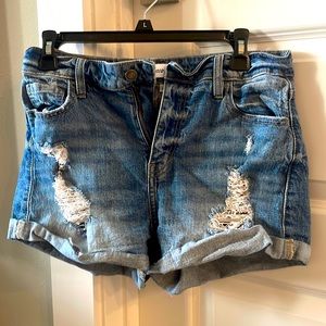 Studio Blue distressed denim shorts.